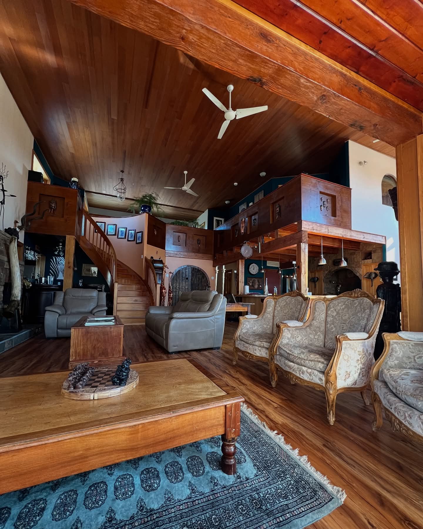 The lodge great room with timber beams and comfortable seating